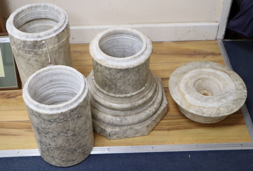 A variegated cream marble pedestal, height 110cm